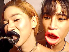 Teen ladyboys both pissed on their big lips and sucking cock together