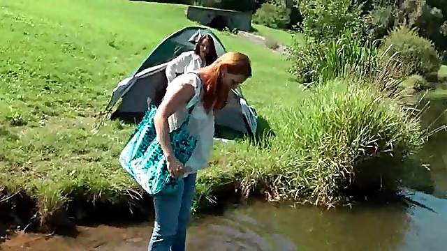WAM appealing clothed babe gets wet in the lake