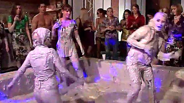 Hot bodied lesbos fighting in messy mud at a sex party
