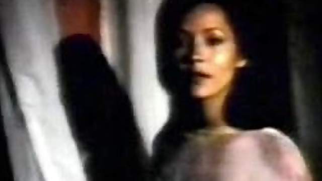 Barbara Carrera In a See-Through Dress
