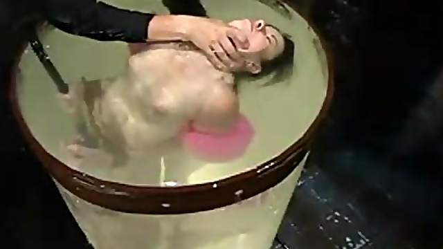 Gorgeous brunette loves being dipped in the water