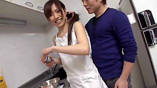 A cute Asian babe gets fucked on a kitchen table
