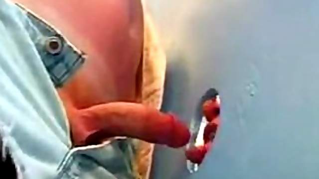 Horny Gay Dude Sucks On A Big Cock Through A Gloryhole