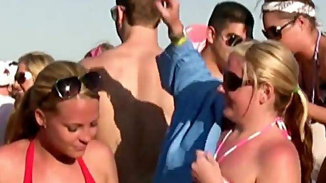 Party girls in and out of their bikinis while having fun at the beach