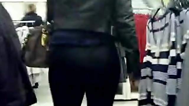 Big-assed chick wearing legging caught on camera in a shop