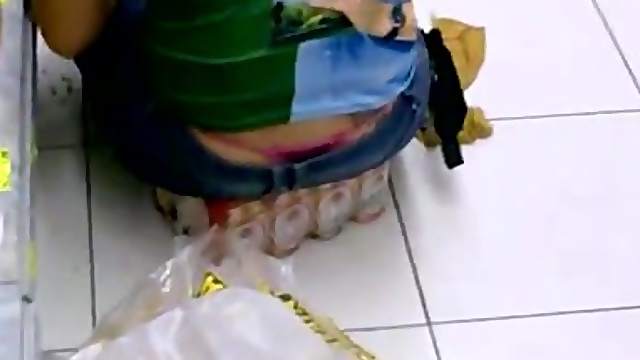 Girl's thong stick out of her jeans in supermarket