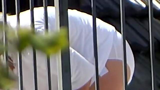 Chick in panties gets caught on a hidden cam while working in a garden