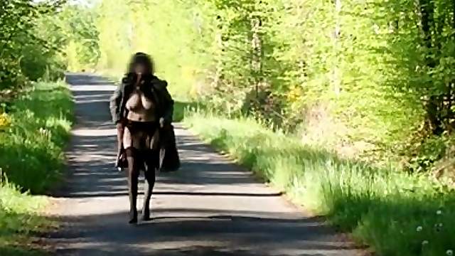 Outdoor homemade clip with a brunette flasher wearing stockings