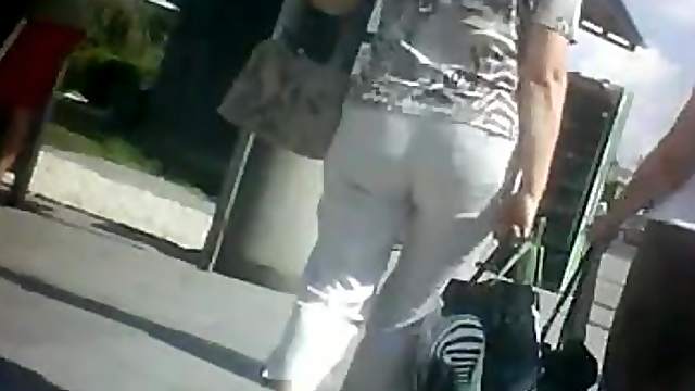 A gal wearing a miniskirt gets caught on a voyeur's cam