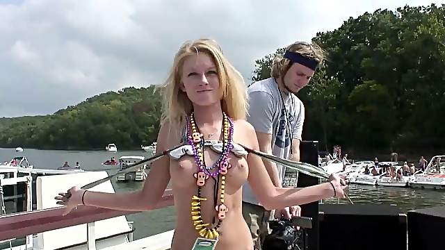 Blistering hot cowgirl in sexy bikini flashes her natural tits in wild yacht party