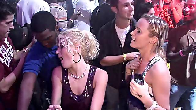 Sexy chick wearing a minidress flashes her butt in a club