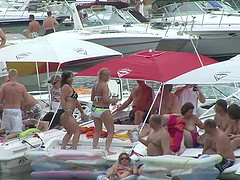 Some slutty chicks flash their nude bodies during a beach party