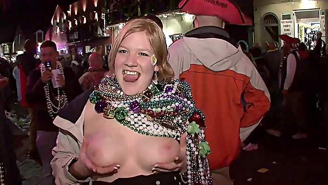 These wild girls whip their tits out in public during a street party