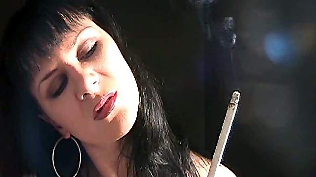 Hot woman has her hot style of smoking