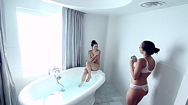 Two hot girls get in the bath and tongue fuck each other