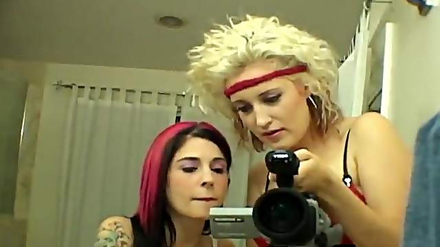 Redhead girl and her blonde friend having kinky fun in the bathroom