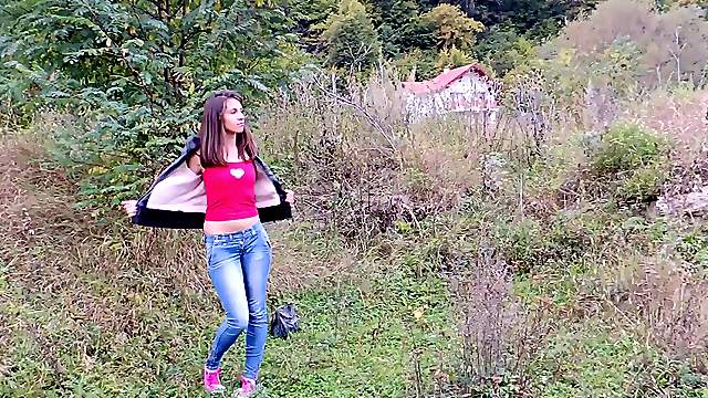 Long haired teen fingering her bald snatch outdoors
