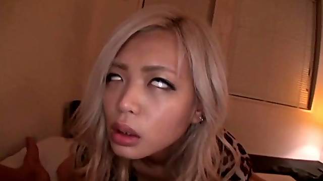 Sexy Asian chick with long blonde hair enjoying a hardcore missionary style fuck