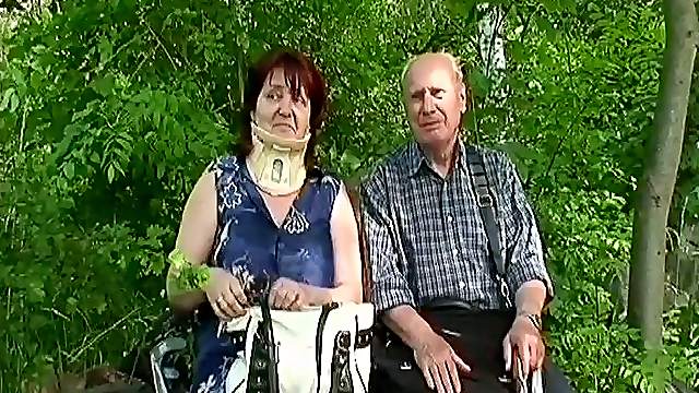 Chubby granny in a neck brace fucks her husband by the lake