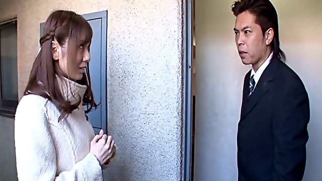 Naughty Japanese housewife gets banged by two horny studs in a threesome clip