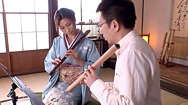 Salacious Asian cougar with a slim body sucking a stranger's cock