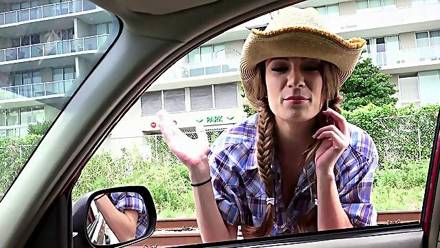 Cowgirl gets in the car and slobbers all over his dick