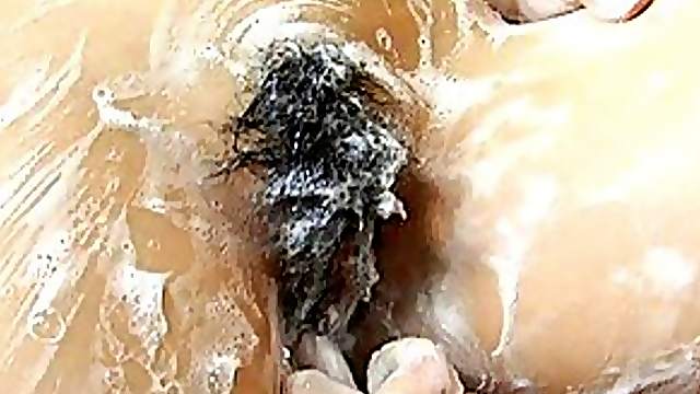 Momo Junna gets all soaped up and gets her pussy fingered