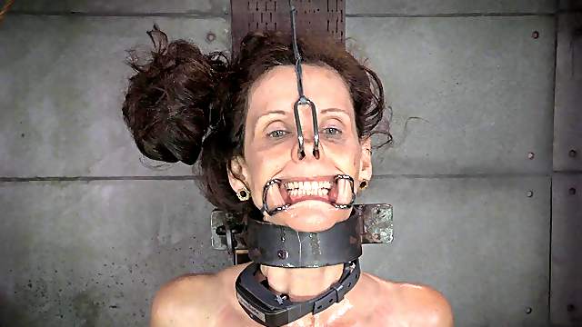 Skinny milf having her pussy pegged in BDSM torture