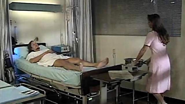 Brunette nurse Brittany Andrews giving dick blowjob