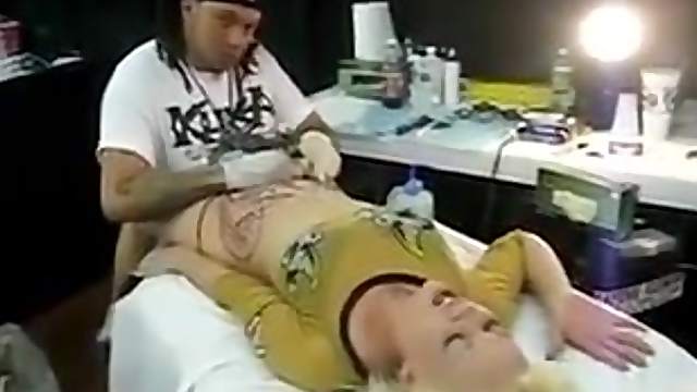 Girl get her pussy tattoo
