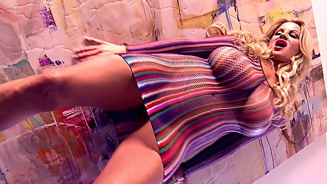Kelly Madison lifts up her dress for a buzzing toy