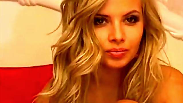 Sexy blonde slut on webcam teasing and toying her pussy with dildo