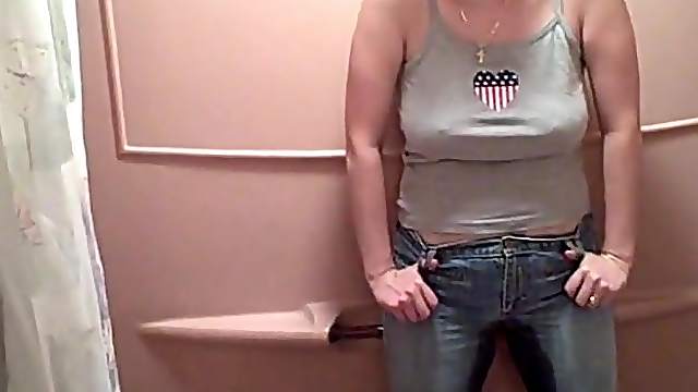 Busty MILF pissing in her pants