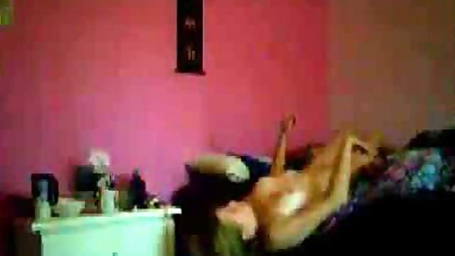 Masturbating at the edge of the bed