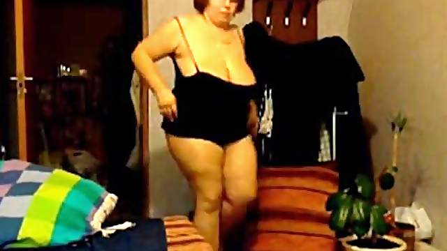 Mature with mega boobs strips off her underwear