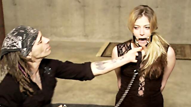 Rough bondage and gagging session for a submissive blonde teen