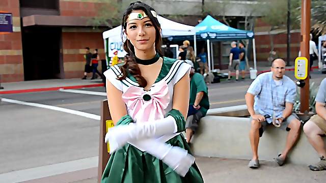 Beautiful girl Melody wears a costume while she walks outdoors