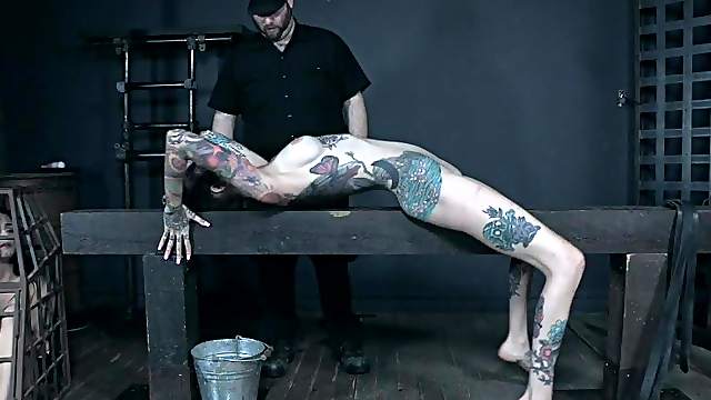 Fetish bondage scene with caged inked teen Rocky Emerson