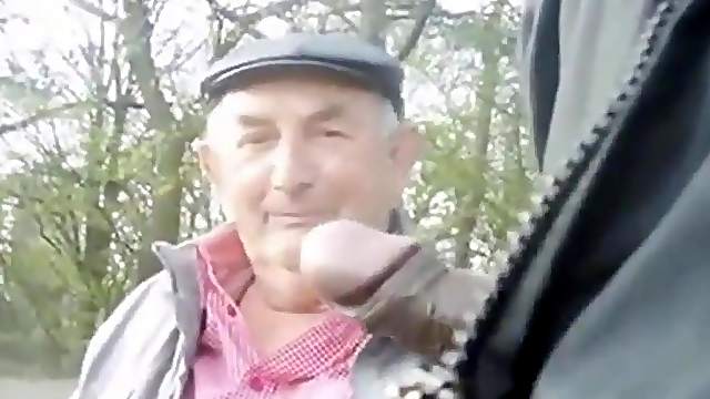 Old gay and young guy met in the park waiting for the third