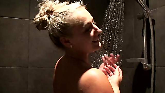 Horny blonde babe with big tits lets her man record how she is washing herself.