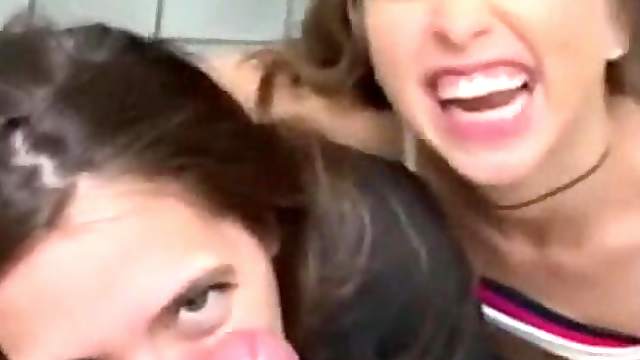 Two horny slut teens sucking big lucky cock in public bathroom