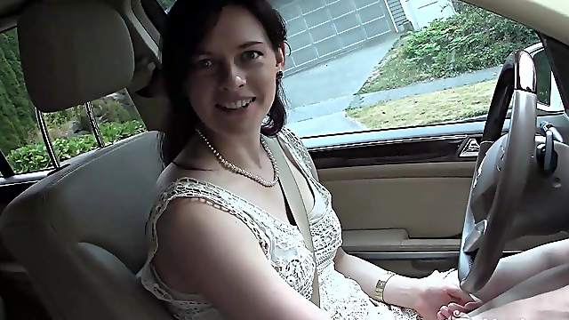 Pretty brunette masturbates in the car during driving