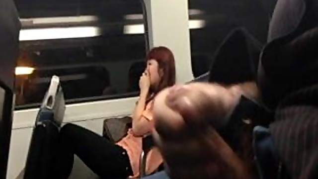 Asian woman laughs at the guy who jerks off on the train