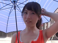 Asian chick Nagase Mami drops on her knees to give a titjob