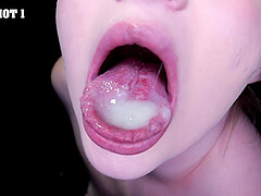 Girls suck and swallow cum through a gloryhole - close up
