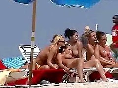 Nude beach hotties get filmed with a hidden cam while having rest