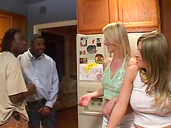 Two blond chicks are under a black penetration