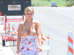 Blonde chick with a hot body flashing her massive tits in public