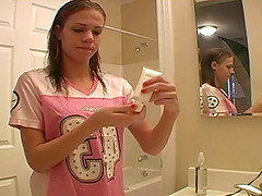 Dashing teen fairy applies her make up in front of the mirror