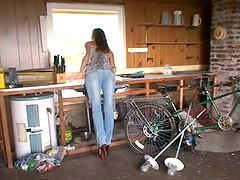 Captivating cougar in jeans showcasing her tits before giving out handjob